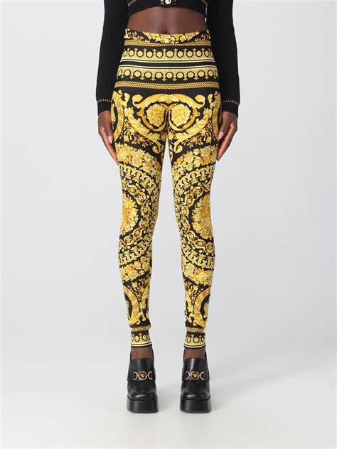 Versace Leggings in tessuto stretch oro e nero con stampa 